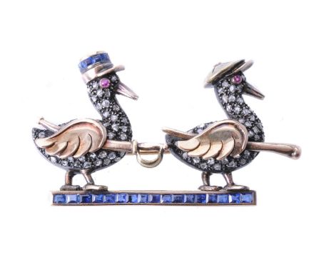 A 1940s French Tunisian diamond and sapphire novelty Gendarme duck brooch, the marching ducks one with an oversized flat cap 