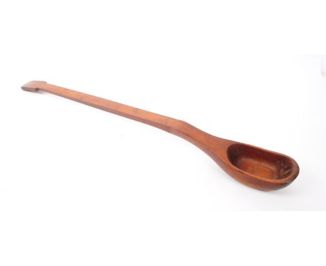 A vintage 20th century mahogany wooden oversized spoon / ladle.93cm length approx.
