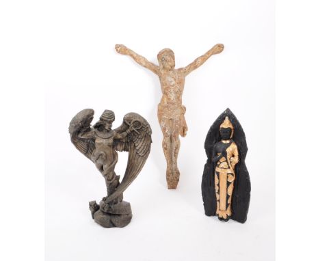 A collection of three 20th century religious figures. The collection to include a carved wooden figure of Lilith, a ceramic g
