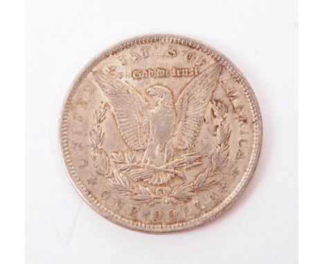 A 1889 United States of America .900 silver Morgan Dollar coin. Having liberty head (left) to obverse, eagle within wreath to