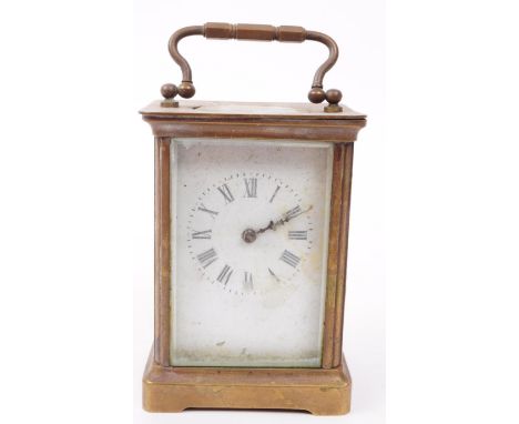 An early 20th century brass carriage clock. The clock having roman numeral to chapter ring with swan neck handle raised over 