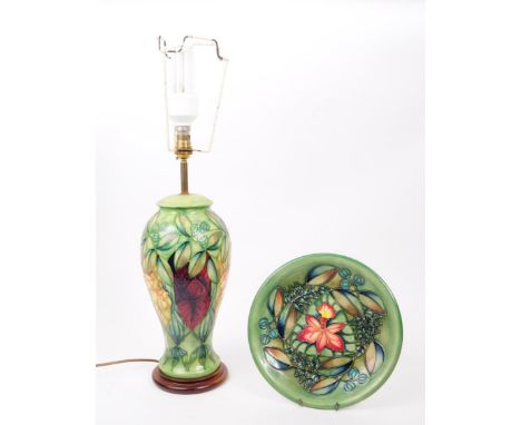 Moorcroft Pottery - Two hand painted ceramic ' rainforest ' pattern items. The lot to include a ceramic hand painted desk lam