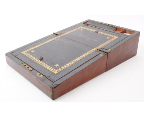 A Victorian 19th Century mahogany writing slope. The writing slope being of smalled squared proportions with brass string inl