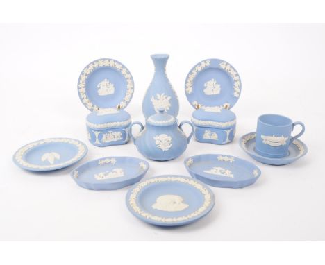 A collection of vintage Wedgwood Jasperware bisque porcelain items. The lot to include five coffee saucers, a coffee cup, tri