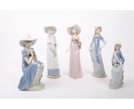 Nao / Lladro—A collection of vintage 20th-century Spanish porcelain figures/statues. All depict females with headwear and dre