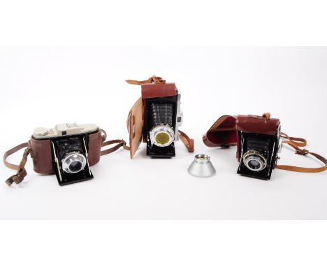 A collection of three 20th century folding viewfinder cameras. The collection to include a Zeiss Ikon Telma Nettar 515 75mm F