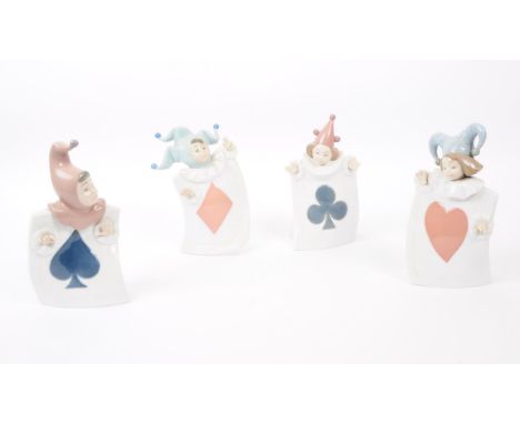 Nao for Lladro, Spain - a full set of four hand painted fine bone china porcelain figures of children dressed as jesters. Eac