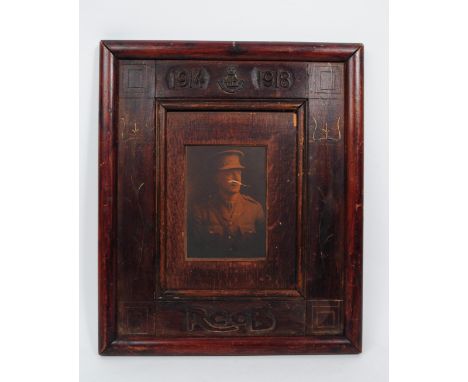 An early 20th century 1914-1918 WWI portrait. The portrait framed in wooden frame, with recessed center. Featuring dates 1914