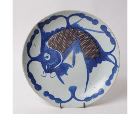 A 19th century Chinese blue and white fish algae display plate. Depicting a leaping carp on a ceramic stoneware dish.26cm dia