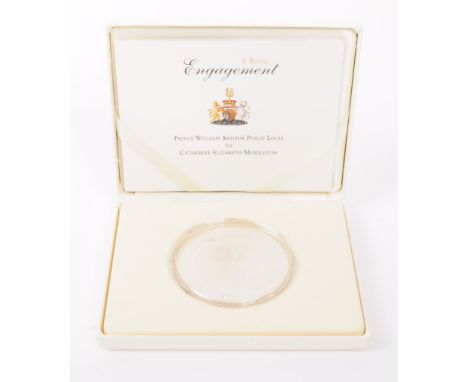 Royal Mint - A 2010 Royal Mint Royal Engagement Prince William and Catherine Middleton Alderney £10 0.999 silver coin. The co