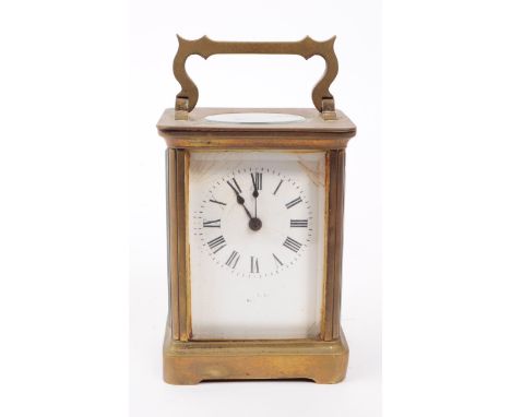 A vintage early 20th century French brass carriage clock with key, marked 'SRFA' to the mechanism. Featuring a carry handle t