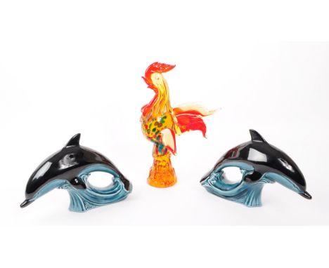 A collection of x3 late 20th century glass animal pieces, to include x2 Poole pottery dolphins and Murano style cockeral. Dol