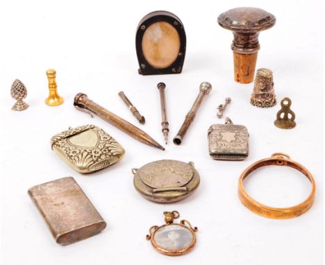 A collection of 19th century ad early 20th century to include two white metal vesta case, a mirrored needle case, repousse th
