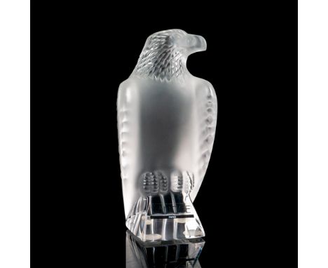 A vintage figure of a bold eagle at rest. Crafted to depict feather like details. Satin finished figure on clear base. Etched