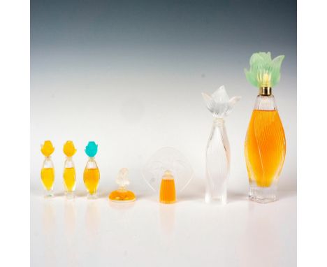 Set of seven vintage crystal perfume bottles with gorgeous art deco stoppers. Includes one 100mL Nilang bottle with mint gree
