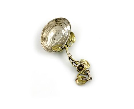 A Victorian cast parcel-gilt silver caddy spoon, by Francis Higgins, London 1862, shell bowl, pierced lily pad handle, length