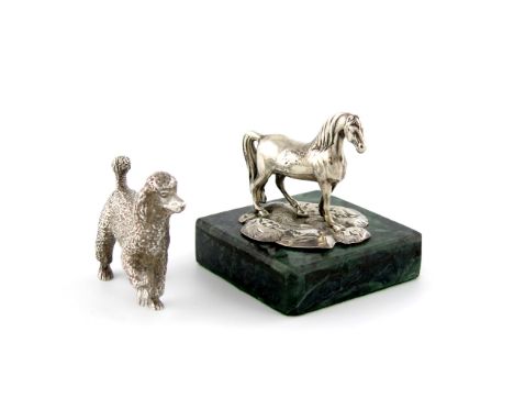 A Victorian silver finial, part marked, modelled as a standing horse, mounted on a green marble base, length 7.8cm, plus a mo