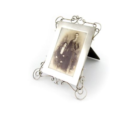 A late-Victorian silver photograph frame, by James Samuel Bell & Louis Willmott, London 1896, rectangular form, with applied 