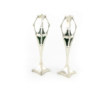 A pair of Edwardian silver and enamel candlesticks, by Williams Limited, Birmingham 1909, tapering square form, with panels o