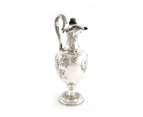 A Victorian silver ewer, by John Samuel Hunt, London 1851, baluster from, embossed with trailing grape vines and bunches of g
