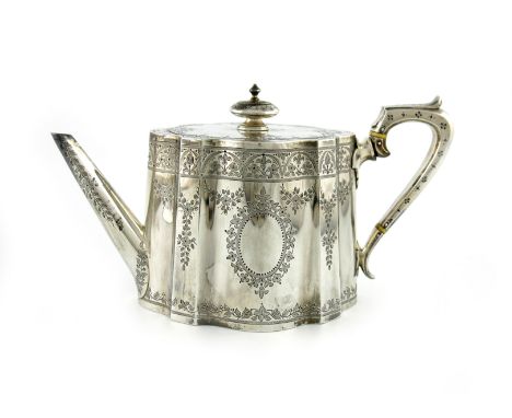 λA Victorian silver teapot, by The Barnards, London 1876, shaped oval form, engraved foliate decoration, scroll handle with i