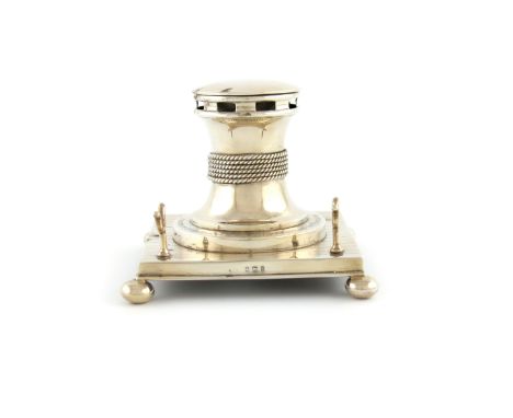 An Edwardian Royal presentation silver inkwell, maker's mark worn, Birmingham 1904, modelled as a capstan, hinged cover, with