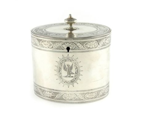 A George III silver tea caddy, by Hester Bateman, London 1782, oval form, flush-hinged cover with an urn finial, engraved bor