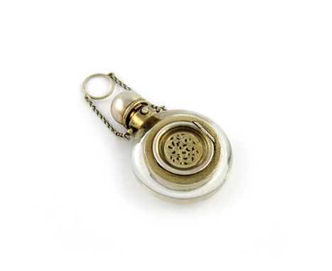 A Victorian silver-gilt and glass scent bottle / vinaigrette, probably by S. Mordan, plain circular form, the hinged glass fr