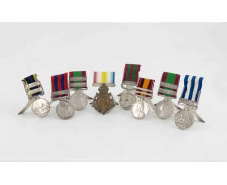 A collection of eight menu card holders formed from medals, two by Horton & Allday, Birmingham 1902, one Chester 1933, and fi