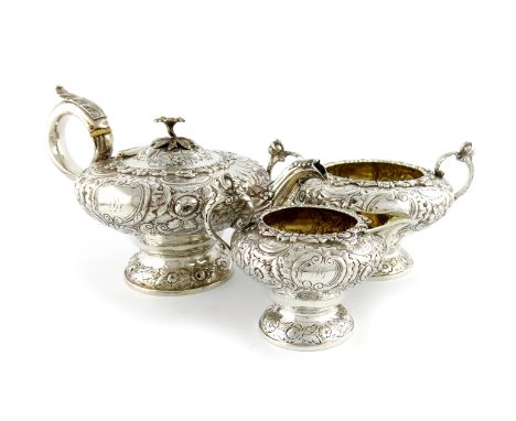 λA three-piece William IV silver tea set, by John Wakefield, London 1832, circular and tapering form, lead capped scroll hand