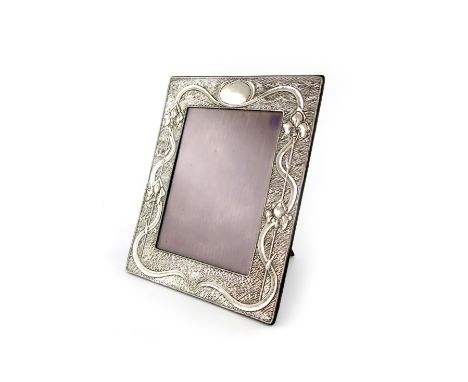 An Edwardian Art Nouveau silver photograph frame, by A and J Zimmerman, Birmingham 1906, rectangular form, with sinuous folia