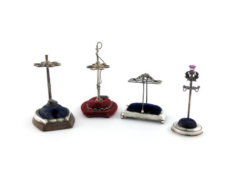 A novelty silver hat pin stand, by Crisford and Norris, Birmingham 1910, the stem modelled as a hunting whip, finial missing,