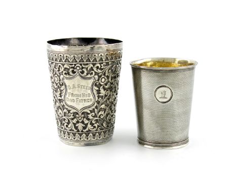 A George III silver beaker, London 1820, tapering circular form, engine-turned decoration and base, engraved with a crest, he