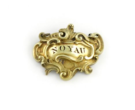 A William IV silver-gilt wine label, by Paul Storr, London 1835, also marked with a French import mark, scroll cartouche form