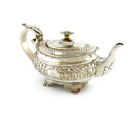 λA George IV silver teapot, by Thomas Death, London 1820, oblong bellied form, part-fluted decoration, leaf capped scroll han