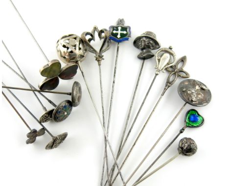 A collection of fifteen silver hat pins, comprising: an Edwardian one by Charles Horner, Chester 1904, heart form with blue a