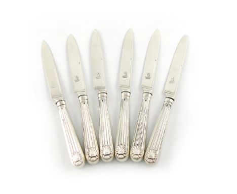 A set of six George III silver fruit knives, by Paul Storr, London 1818, the plain blades with a crest, tapering reeded handl