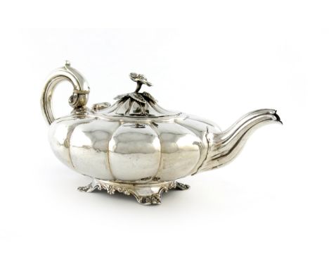 An early-Victorian silver teapot, by John James Keith, London 1837, compressed lobed circular form, scroll handle with ivory 