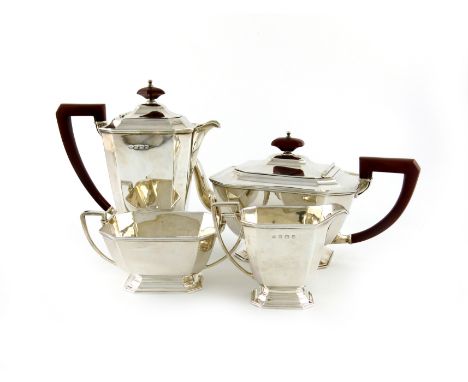 A four-piece Art Deco tea set, by The Adie Brothers, Birmingham 1937, tapering panelled rectangular form, scroll handles, on 