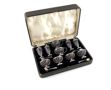 A ten-piece silver condiment set, by William Hutton and Sons Limited, Sheffield 1933, circular wire-work form, comprising: tw