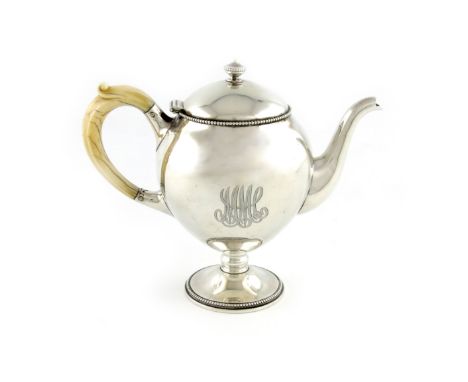 λAn American silver teapot, by Gorham and Co, retailed by Mermoid and Jaccards, circa 1900, ovoid form, carved ivory scroll h