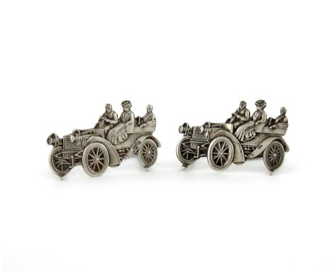 A pair of Edwardian novelty silver menu card holders, by Levi and Salaman, Birmingham 1909, modelled as a vintage car, with t