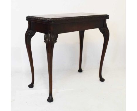 Early 20th Century mahogany fold-over card table, in the mid 18th Century manner, the top with gadrooned edge enclosing green