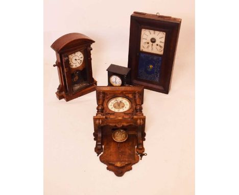 Four clocks to include; an American wall clock, slate mantel clock, etc