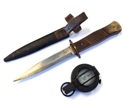 First World War German trench dagger by Gottlieb, with a 15cm length spear pointed blade, and slab sided wooden grips, togeth