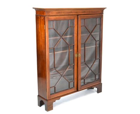 20th Century inlaid mahogany bookcase with glazed astragal doors on bracket feet, 106cm x 27cm 132cm