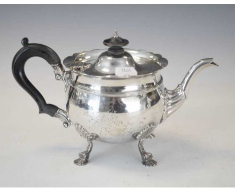George V silver tea pot, in the George II taste with wavy rim, fluted and leaf-capped spout and four supports with palmette m