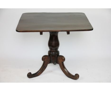 A George III oak tilt top occasional table, with turned column on tripod base, 72cm H x 86cm W x 76cm D