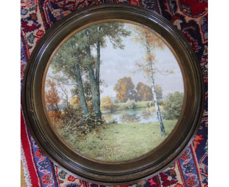 A continental porcelain circular plaque, painted with a rural scene of a silver birch beside a river, signed K. Siliuster Lub