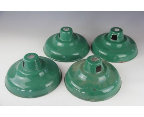 A set of four vintage green enamel ceiling light shades of coolicon type, 26cm diameter